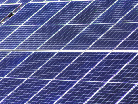 Endless cells of solar panels farm generating renewable electricity from sun energy in Australia, NSW.